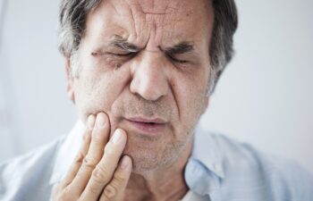 Old man with toothache