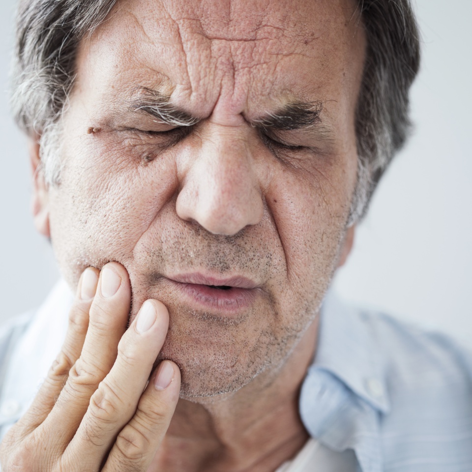 Old man with toothache